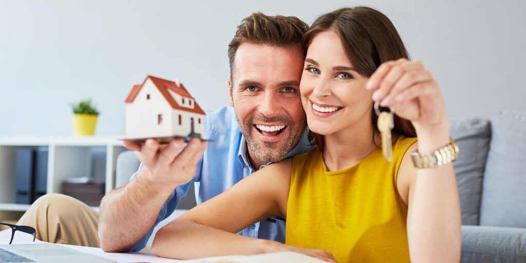 Couple with house and key